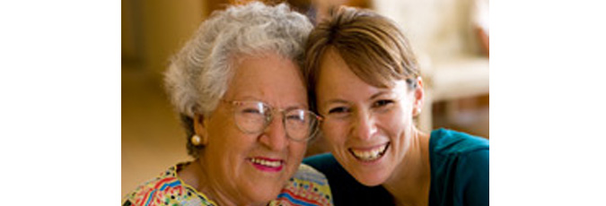 Picture of older woman with younger woman smiling